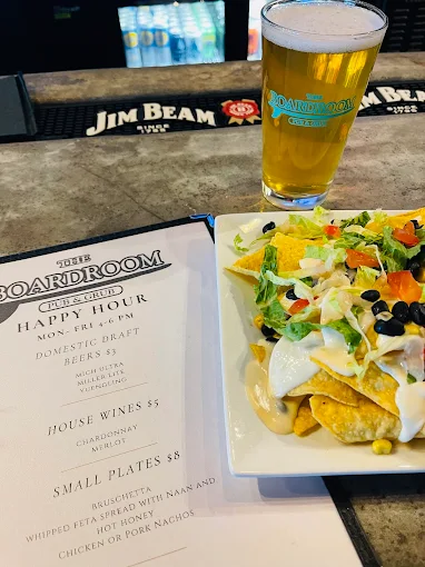 Happy hour beer and shareable plate at The Boardroom